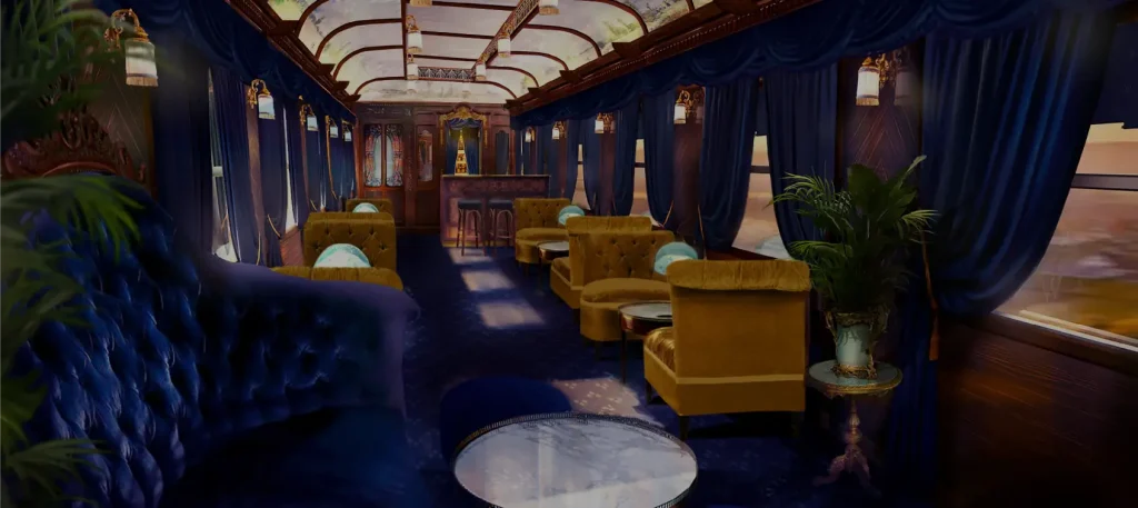 Voiture salon luxe train Grand Tour France avec fauteuils dorés, draperies bleues et verrière Art Déco