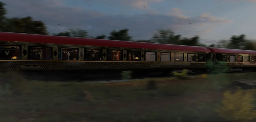 Train de luxe Grand Tour France en mouvement à travers la campagne française, voitures élégantes bordeaux et noir