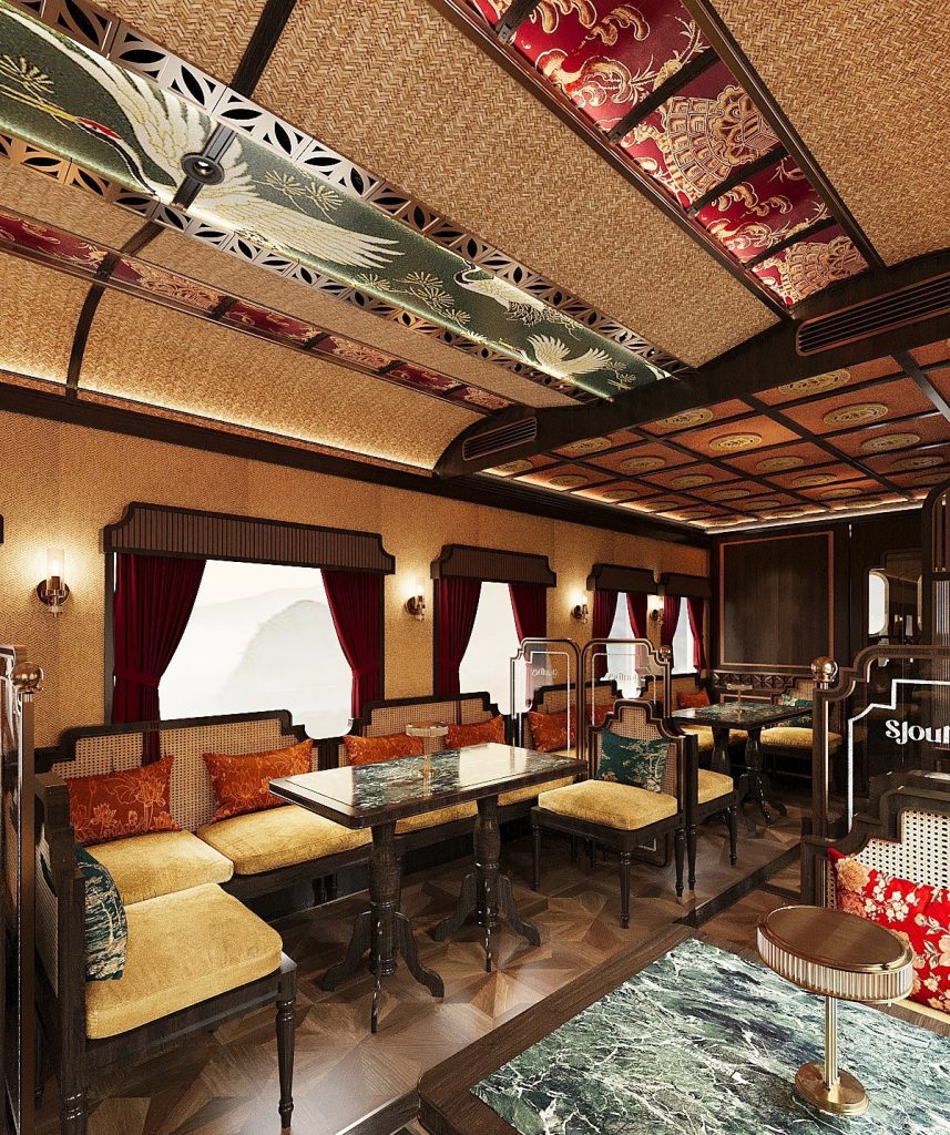 Voiture bistro du train de luxe SJourney Vietnam — atmosphère Indochine avec tables dressées et lumière tamisée