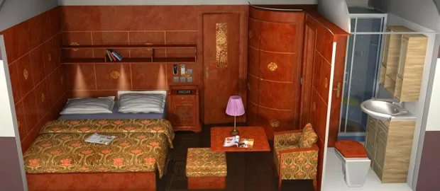 Cabine Suite Deluxe du train Al Andalus en mode nuit avec grand lit double et boiseries Belle Époque
